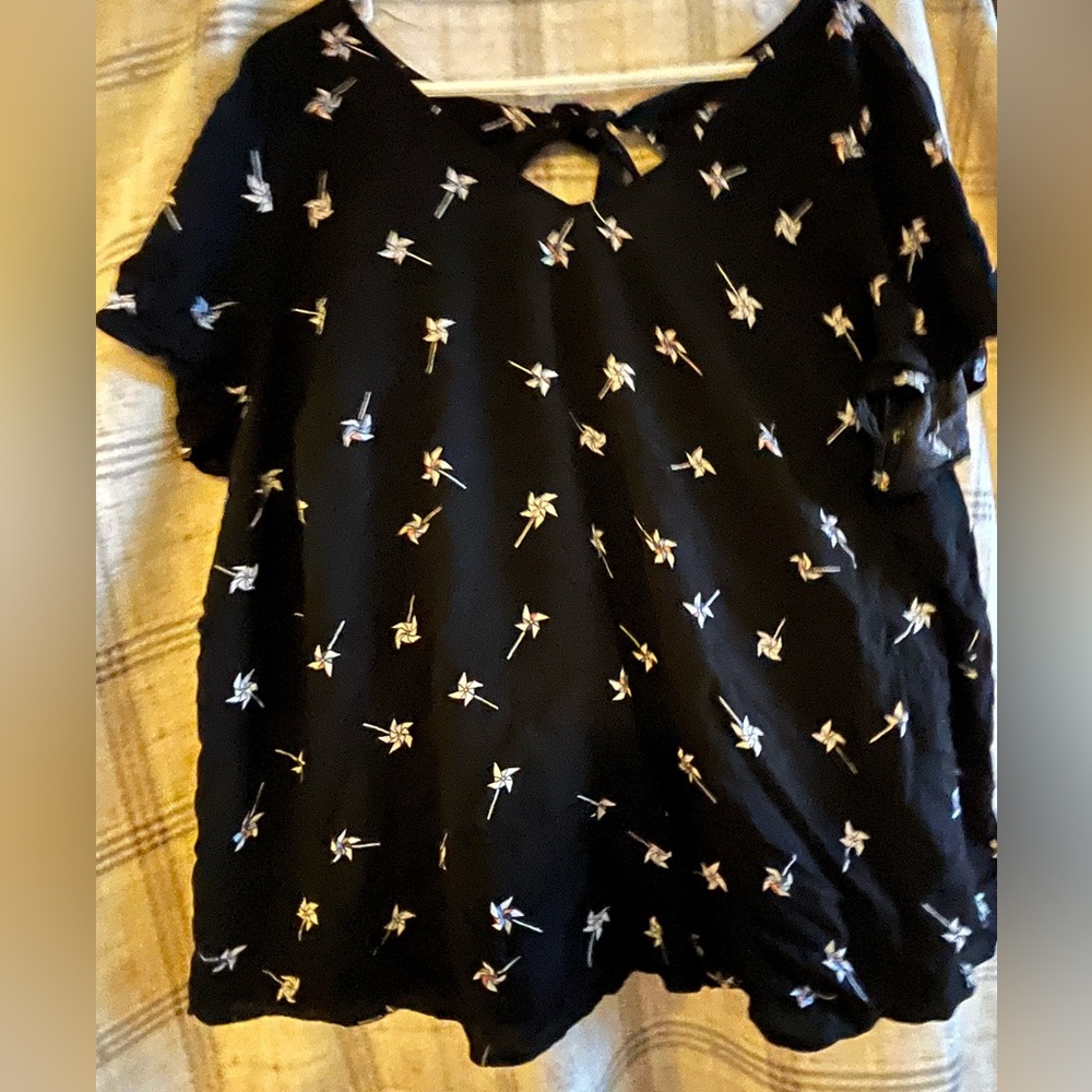 Torrid 3, pinwheel patters with keyhole back.